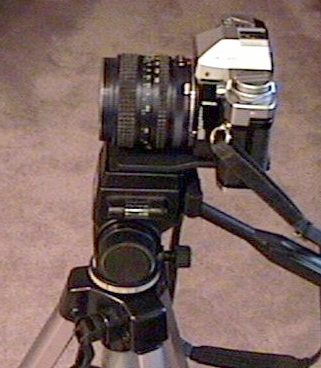 35mm SLR Camera on tripod with pan head